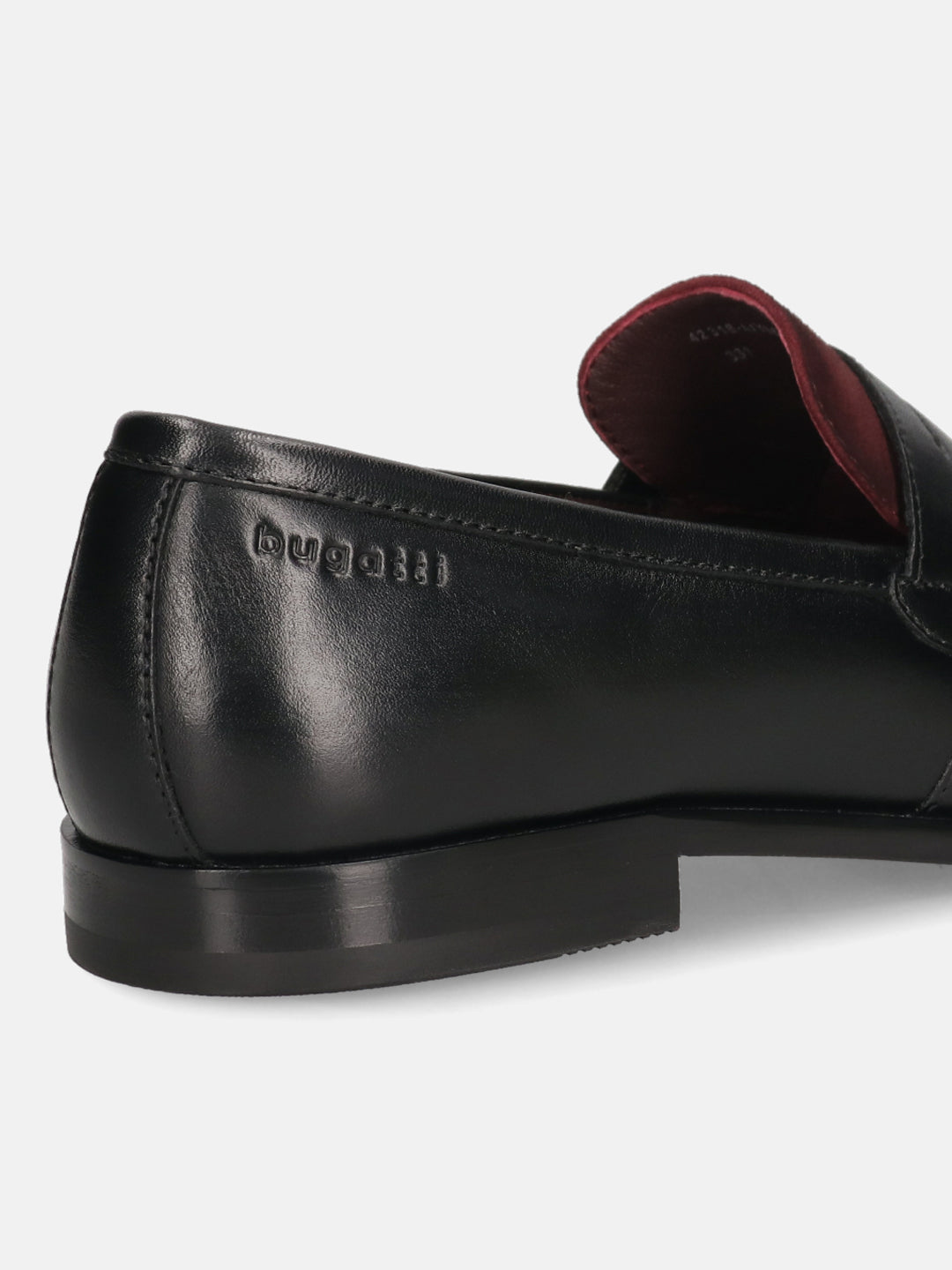 Black leather loafers by bugatti, showing burgundy lining and a low heel.