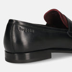 Black leather loafers by bugatti, showing burgundy lining and a low heel.