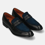 Black leather and suede penny loafers by bugatti, featuring a dark blue suede vamp and brown lining.
