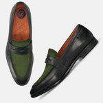 Black leather comfort penny loafers by bugatti, with green suede vamp and the brand logo on the side.