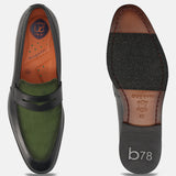 Black leather loafer by bugatti, featuring a dark green suede vamp and a comfortable sole.
