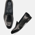 A black Men's bugatti Venetian Loafers featuring a round toe plain toe, stacked heel. Made from premium genuine leather with a durable leather outsole, this slip-on design offers both style and comfort.