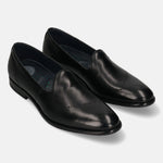 A black Men's bugatti Venetian Loafers featuring a round toe plain toe, stacked heel. Made from premium genuine leather with a durable leather outsole, this slip-on design offers both style and comfort.