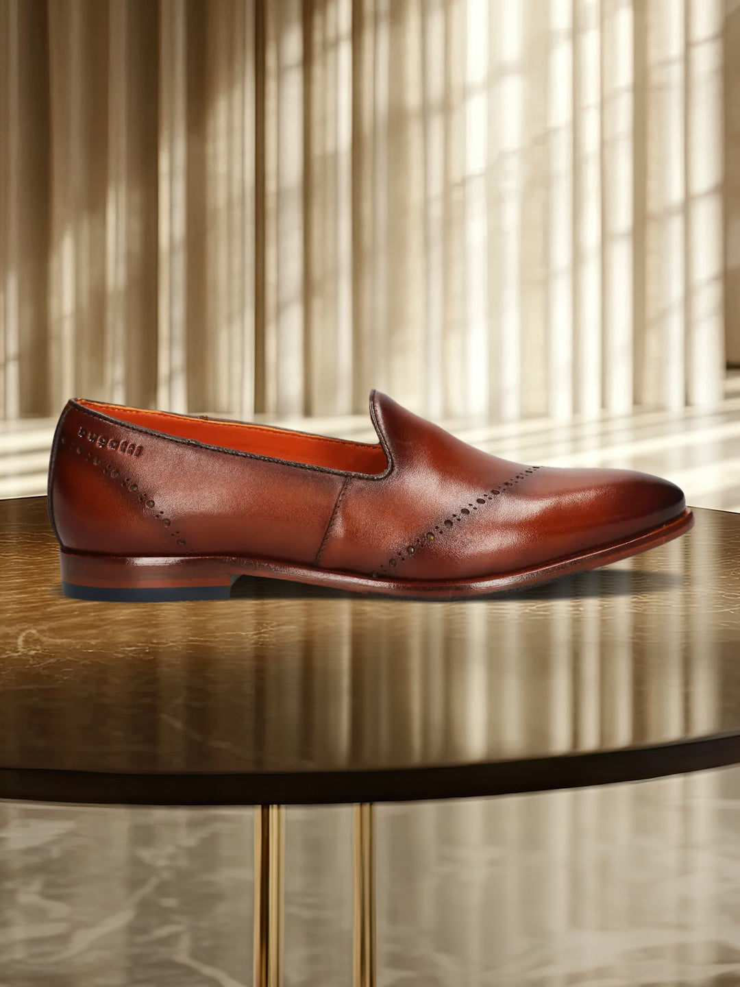 A cognac Men's bugatti Venetian Loafers featuring a round toe plain toe, stacked heel. Made from premium genuine leather with a durable leather outsole, this slip-on design offers both style and comfort.