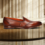 A cognac Men's bugatti Venetian Loafers featuring a round toe plain toe, stacked heel. Made from premium genuine leather with a durable leather outsole, this slip-on design offers both style and comfort.