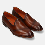 A cognac Men's bugatti Venetian Loafers featuring a round toe plain toe, stacked heel. Made from premium genuine leather with a durable leather outsole, this slip-on design offers both style and comfort.