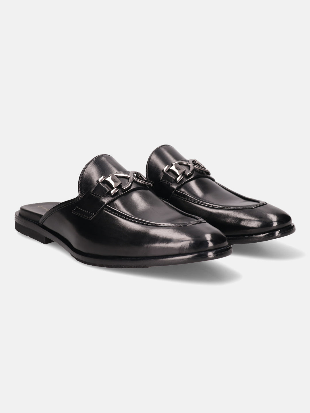 Black leather slip-on shoes by bugatti with silver-toned embellishments, displayed on a white backdrop.