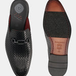 A black Men's bugatti Mules featuring a round toe apron toe, stacked heel. Made from premium genuine leather with a durable leather outsole, this slip-on design offers both style and comfort.