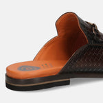 Brown leather slip-on shoe by Bugatti, showing a woven texture and orange insole.