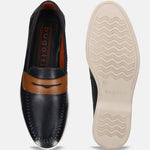 Dark blue leather slip-on shoes by bugatti with brown accents, featuring white stitching and textured soles.