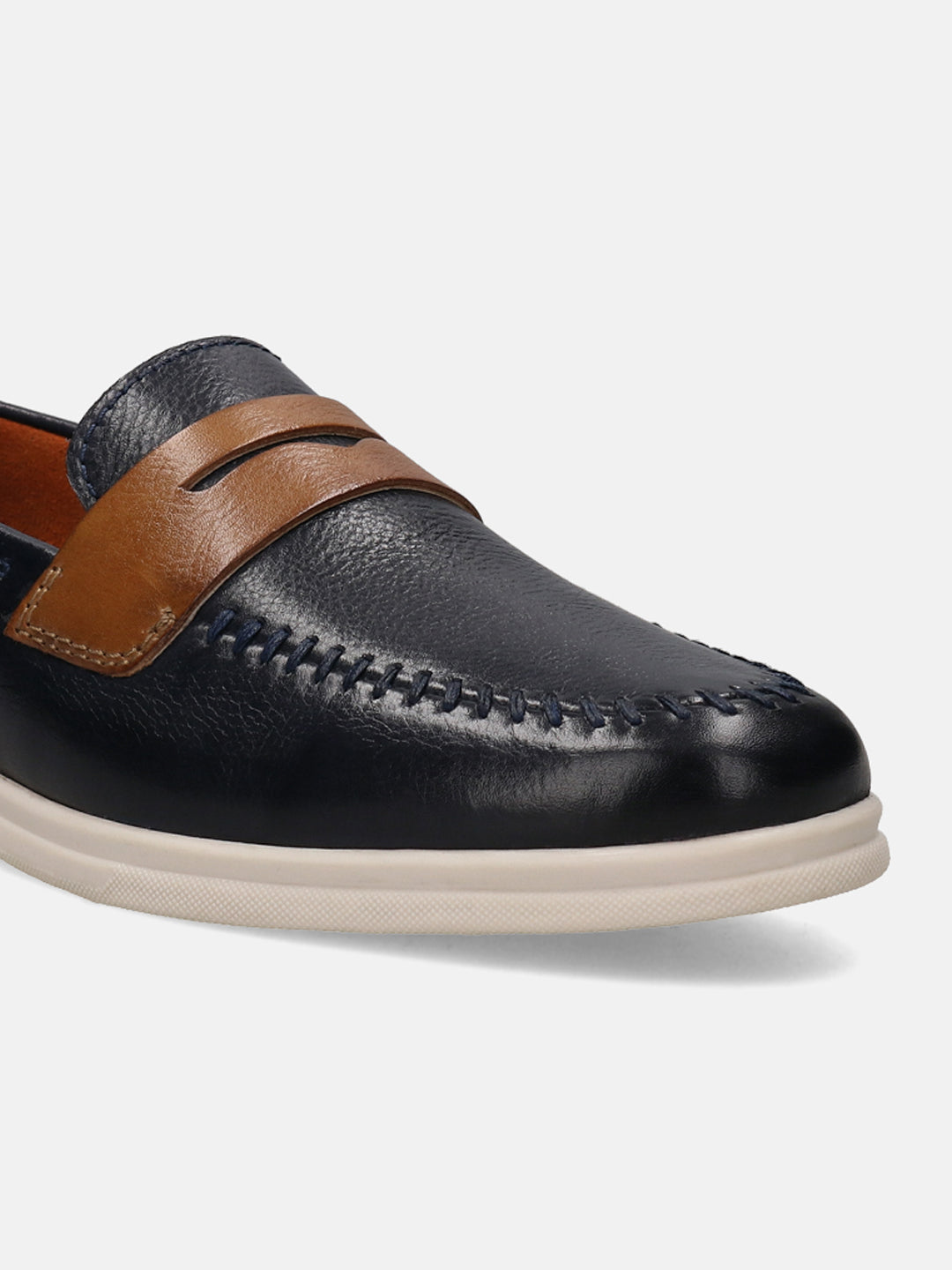 Dark blue leather slip-on shoe by Bugatti, featuring a brown strap and decorative stitching.