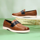 bugatti Sandiago slip-on shoes in cognac leather with a dark accent strap and white soles.