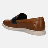 Brown leather slip-on shoe by bugatti with stitched details and a contrasting blue accent.