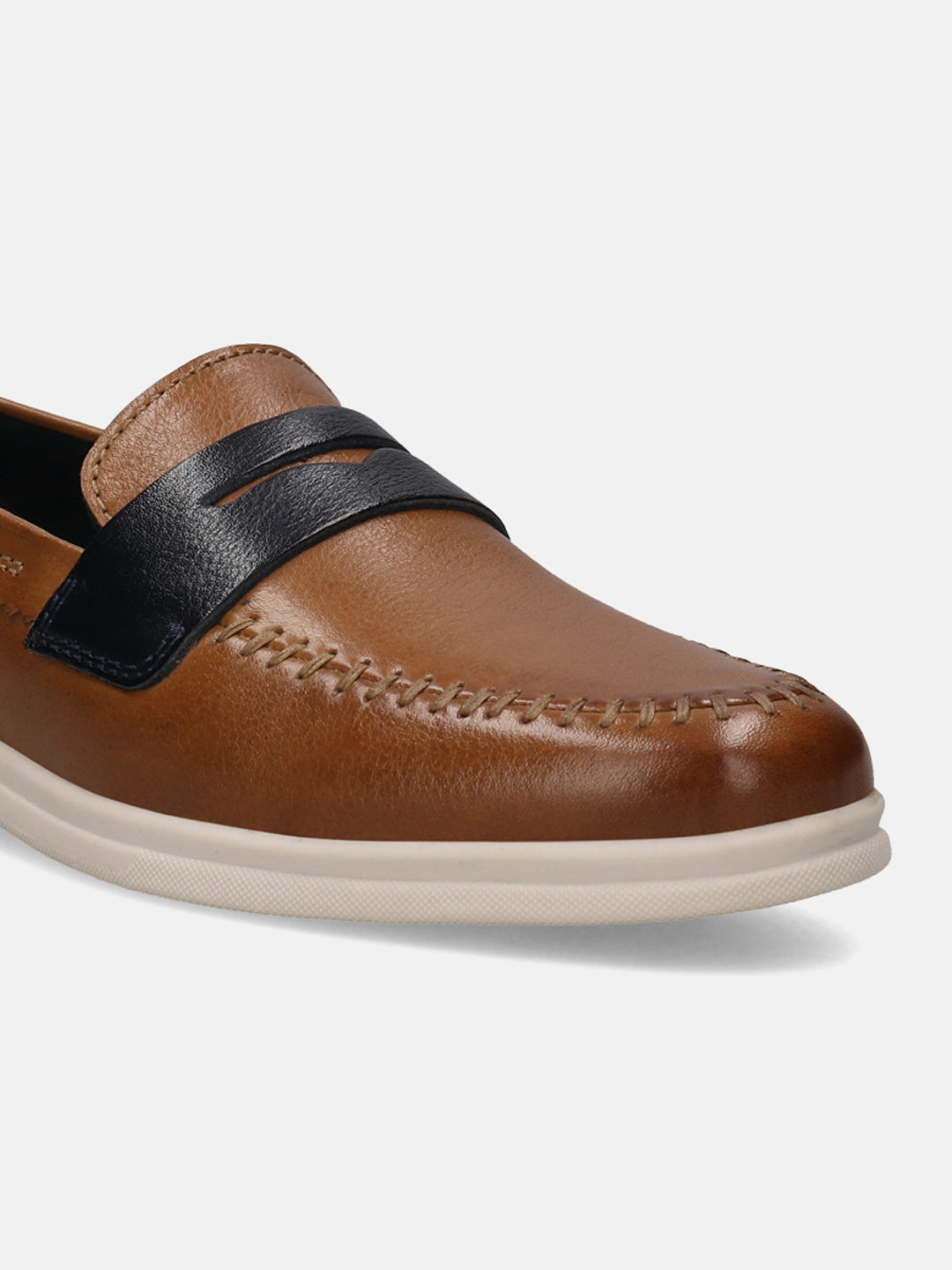 Cognac leather slip-on shoe by bugatti, featuring contrast stitching and a black leather band.