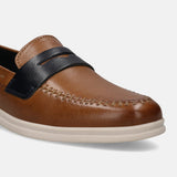 Cognac leather slip-on shoe by bugatti, featuring contrast stitching and a black leather band.