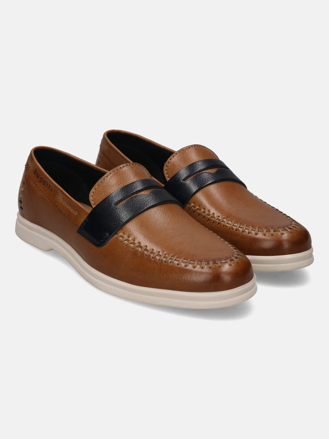 Cognac leather casual slip-on shoes by Bugatti, featuring a black strap, and tonal stitching.