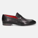 Black leather loafer by bugatti with red lining, featuring a textured vamp and a decorative strap.
