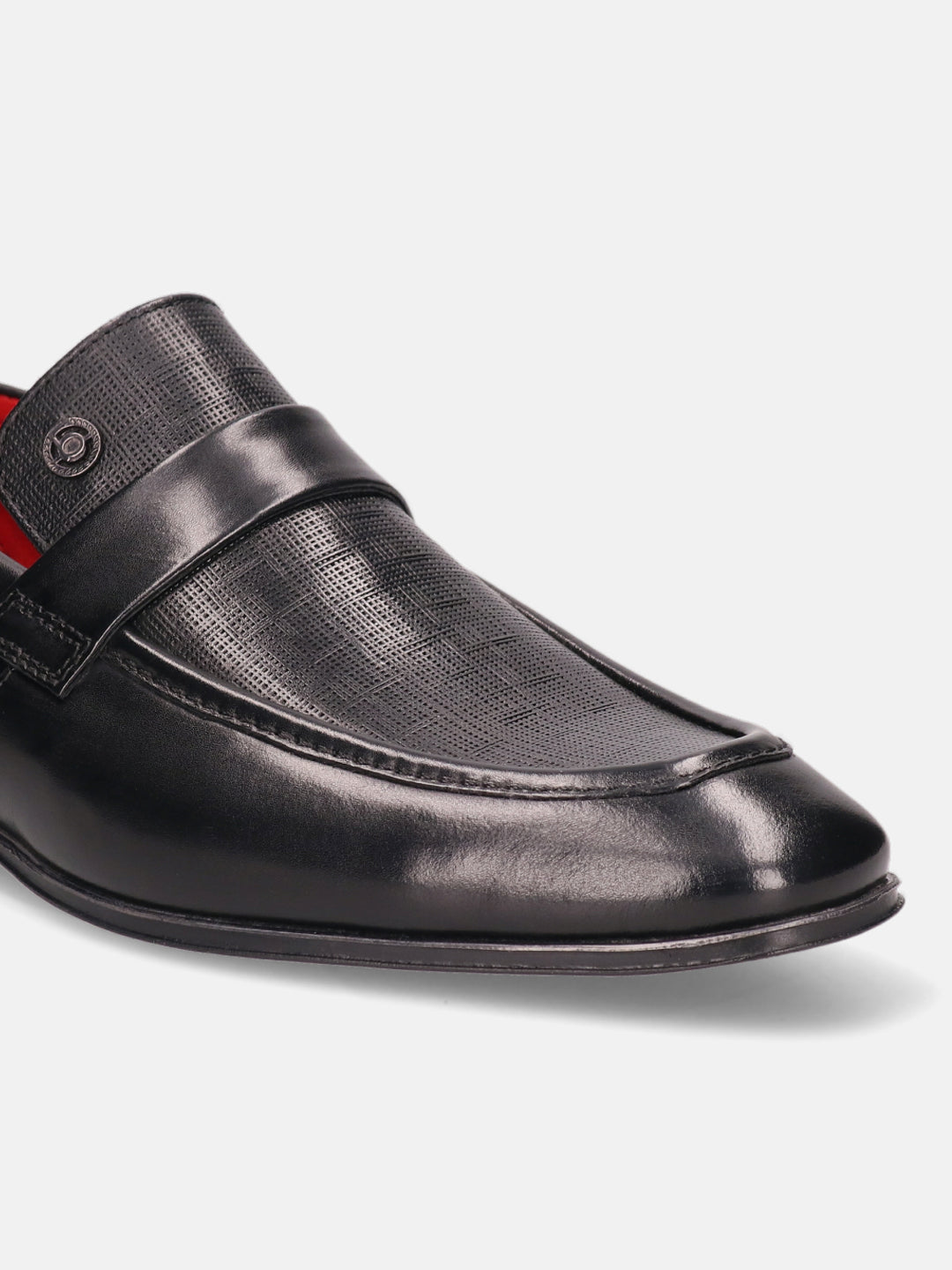 Black leather penny loafer by Bugatti, featuring a textured design and a sleek silhouette.