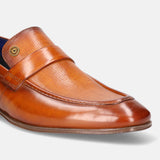 Yellow leather loafer by bugatti, featuring a grid-textured vamp and band with a metallic emblem detail.