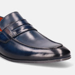 Blue leather penny loafer by Bugatti, showcasing fine stitching detail and a glossy finish.
