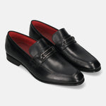 A black Men's bugatti Bit Loafer featuring a round toe apron toe, moulded  heel. Made from premium genuine leather with a durable high quality synthetic outsole, this slip-on design offers both style and comfort.