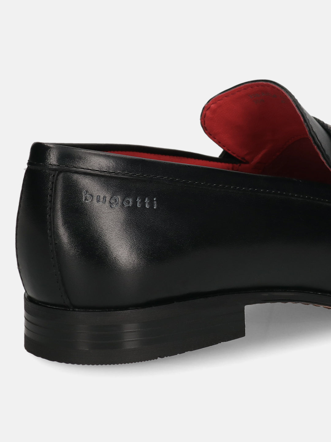 A black Men's bugatti Bit Loafer featuring a round toe apron toe, moulded  heel. Made from premium genuine leather with a durable high quality synthetic outsole, this slip-on design offers both style and comfort.