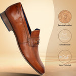 A cognac Men's bugatti Bit Loafer featuring a round toe apron toe, moulded  heel. Made from premium genuine leather with a durable high quality synthetic outsole, this slip-on design offers both style and comfort.