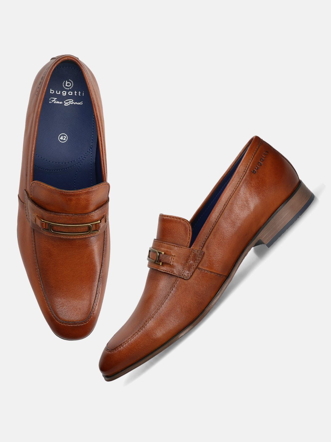A cognac Men's bugatti Bit Loafer featuring a round toe apron toe, moulded  heel. Made from premium genuine leather with a durable high quality synthetic outsole, this slip-on design offers both style and comfort.