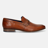 A cognac Men's bugatti Bit Loafer featuring a round toe apron toe, moulded  heel. Made from premium genuine leather with a durable high quality synthetic outsole, this slip-on design offers both style and comfort.