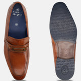 A cognac Men's bugatti Bit Loafer featuring a round toe apron toe, moulded  heel. Made from premium genuine leather with a durable high quality synthetic outsole, this slip-on design offers both style and comfort.