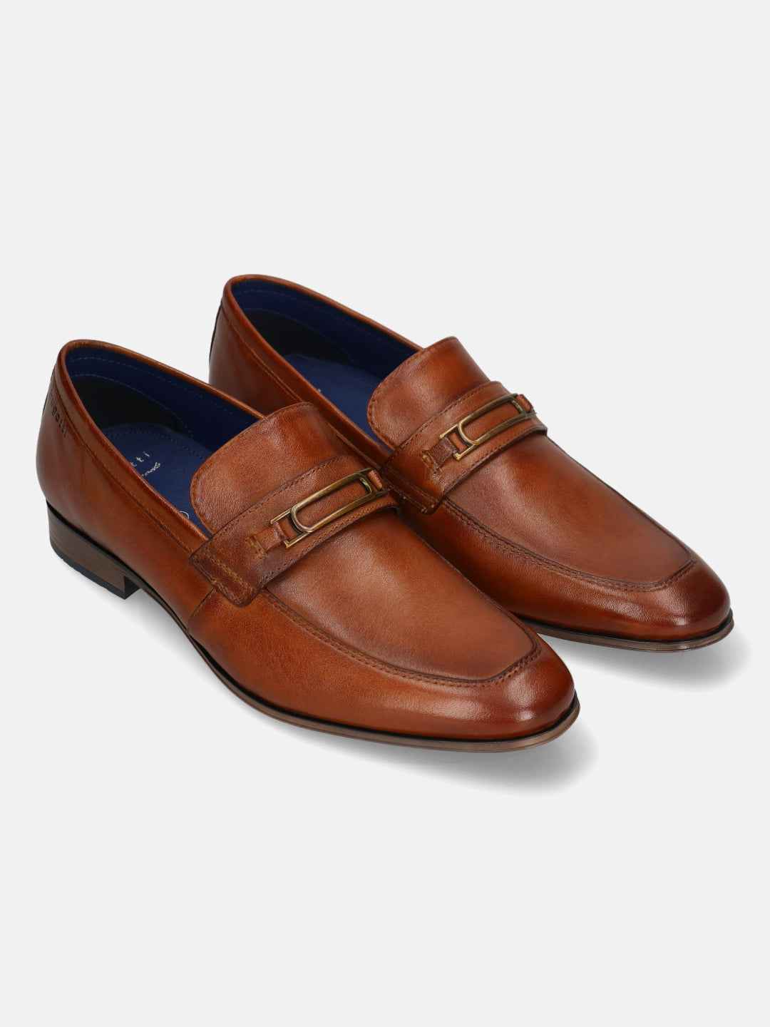 A cognac Men's bugatti Bit Loafer featuring a round toe apron toe, moulded  heel. Made from premium genuine leather with a durable high quality synthetic outsole, this slip-on design offers both style and comfort.