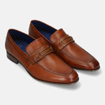 A cognac Men's bugatti Bit Loafer featuring a round toe apron toe, moulded  heel. Made from premium genuine leather with a durable high quality synthetic outsole, this slip-on design offers both style and comfort.
