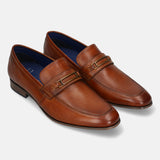 A cognac Men's bugatti Bit Loafer featuring a round toe apron toe, moulded  heel. Made from premium genuine leather with a durable high quality synthetic outsole, this slip-on design offers both style and comfort.