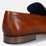 A cognac Men's bugatti Bit Loafer featuring a round toe apron toe, moulded  heel. Made from premium genuine leather with a durable high quality synthetic outsole, this slip-on design offers both style and comfort.
