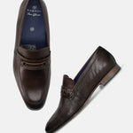 A brown Men's bugatti Bit Loafer featuring a round toe apron toe, moulded  heel. Made from premium genuine leather with a durable high quality synthetic outsole, this slip-on design offers both style and comfort.