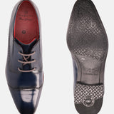 Blue leather derby shoes by bugatti, showing the outsole with patterned grip, including the size 42 and a brand logo.