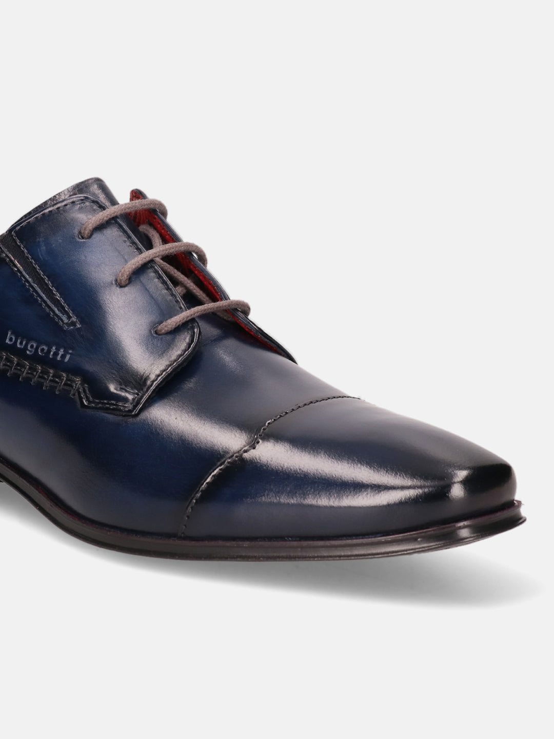 Blue leather derby shoes by Bugatti, featuring gray laces and decorative stitching.