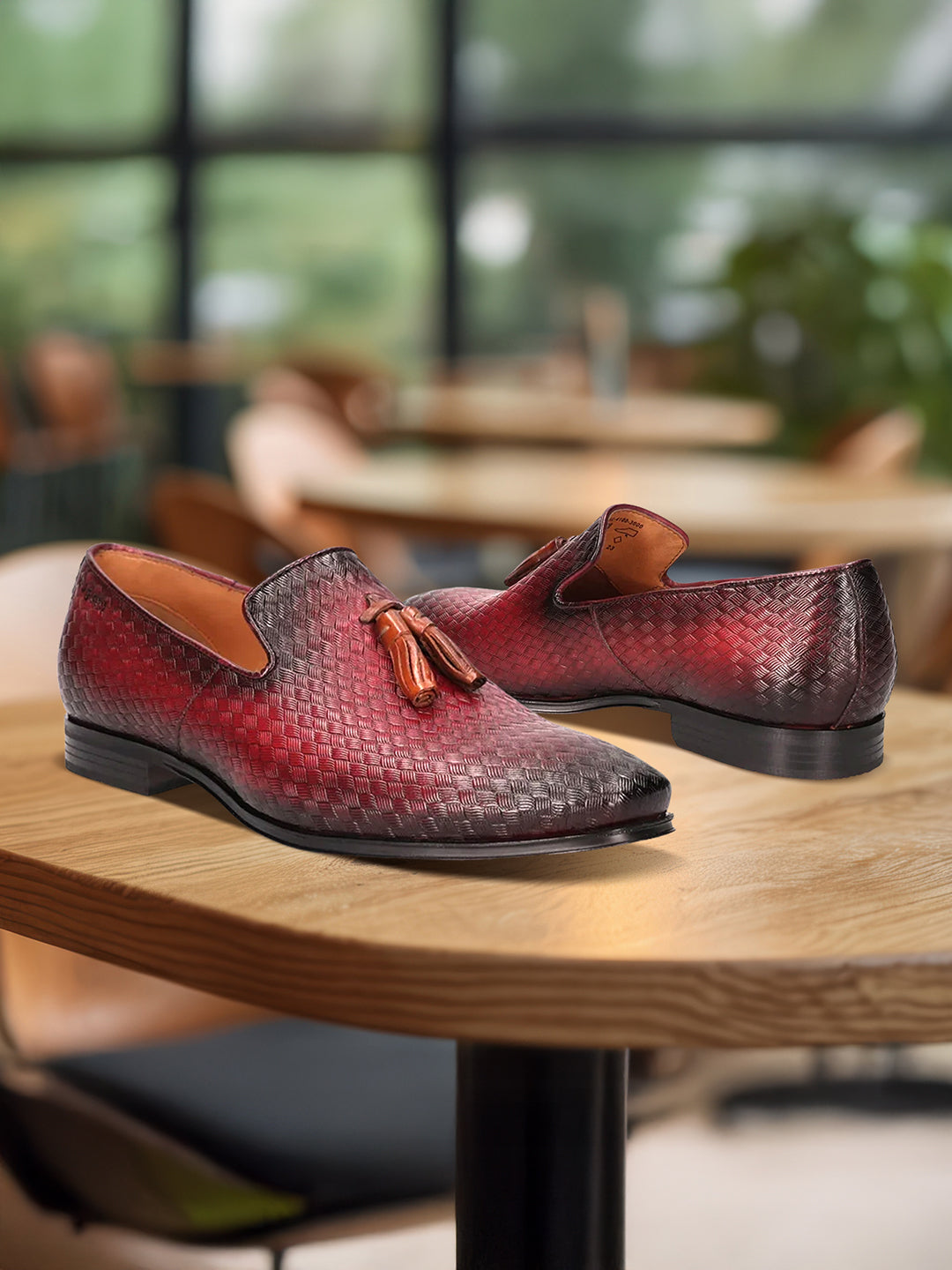 bugatti Margo red leather slip-on dress shoes with a woven texture and tassel detail.