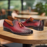 bugatti Margo red leather slip-on dress shoes with a woven texture and tassel detail.