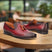 bugatti Margo red leather slip-on dress shoes with a woven texture and tassel detail.