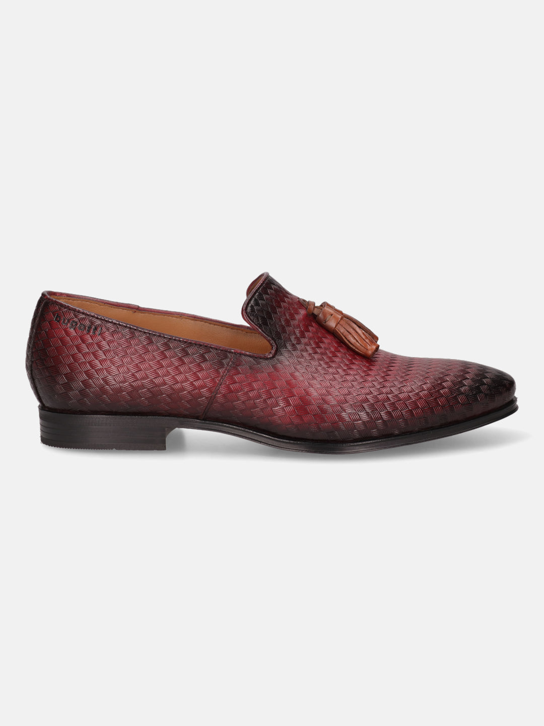 Red leather slip-on shoe by bugatti, with a woven pattern and decorative tassel.
