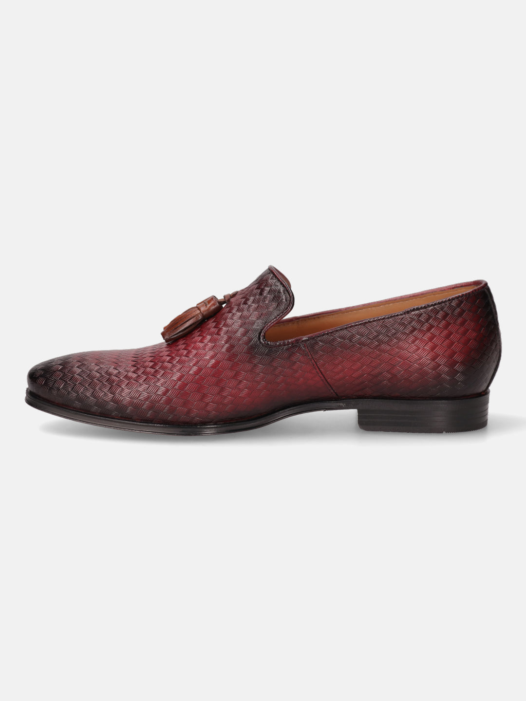 Red leather slip-on dress shoe by bugatti, featuring a woven pattern and decorative tassels.