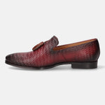 Red leather slip-on dress shoe by bugatti, featuring a woven pattern and decorative tassels.