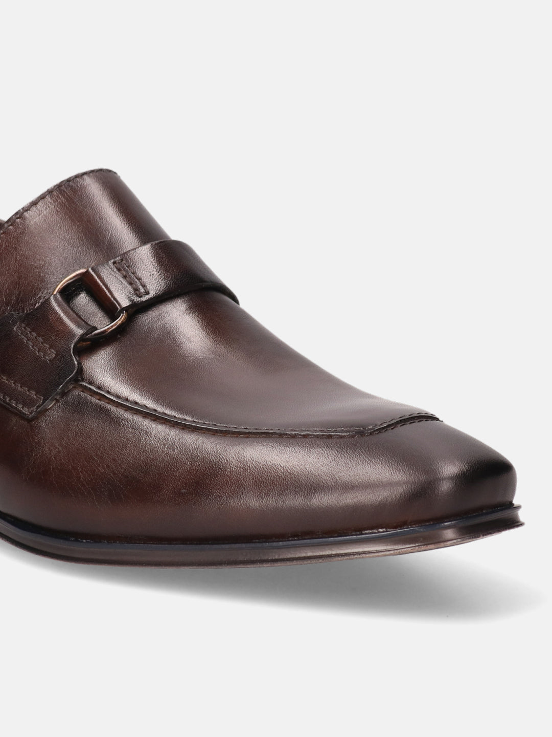 A brown Men's bugatti Bit Loafer featuring a round toe apron toe, stacked heel. Made from premium genuine leather with a durable high quality synthetic outsole, this slip-on design offers both style and comfort.