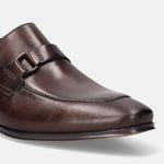 A brown Men's bugatti Bit Loafer featuring a round toe apron toe, stacked heel. Made from premium genuine leather with a durable high quality synthetic outsole, this slip-on design offers both style and comfort.