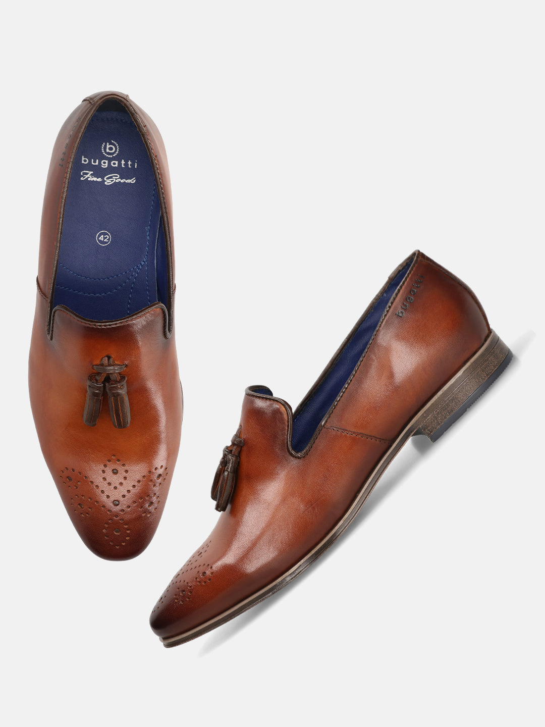 A cognac Men's bugatti Tassel Loafers featuring a round toe plain toe, moulded  heel. Made from premium genuine leather with a durable high quality synthetic outsole, this slip-on design offers both style and comfort.