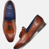 A cognac Men's bugatti Tassel Loafers featuring a round toe plain toe, moulded  heel. Made from premium genuine leather with a durable high quality synthetic outsole, this slip-on design offers both style and comfort.