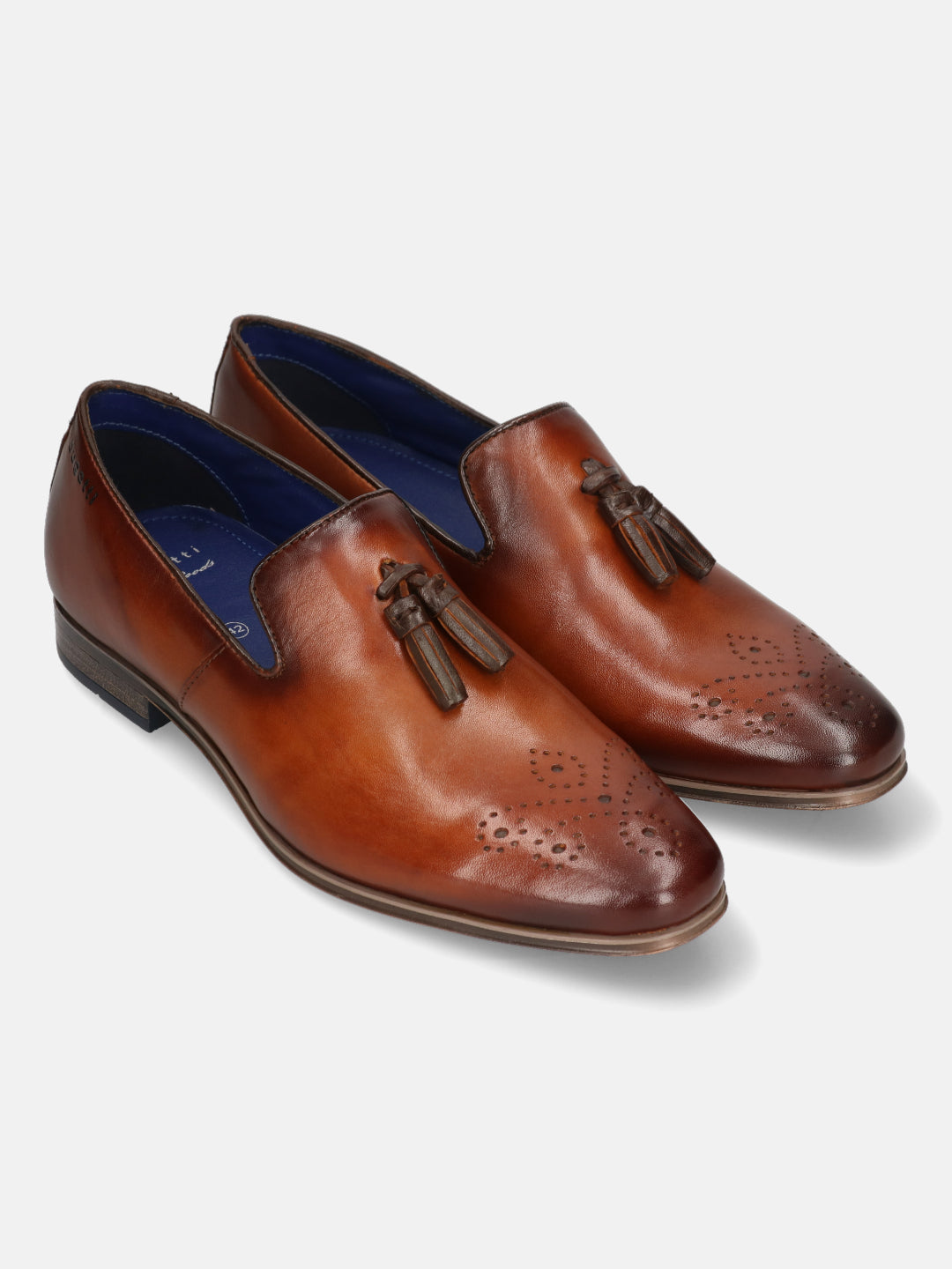 A cognac Men's bugatti Tassel Loafers featuring a round toe plain toe, moulded  heel. Made from premium genuine leather with a durable high quality synthetic outsole, this slip-on design offers both style and comfort.