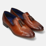 A cognac Men's bugatti Tassel Loafers featuring a round toe plain toe, moulded  heel. Made from premium genuine leather with a durable high quality synthetic outsole, this slip-on design offers both style and comfort.
