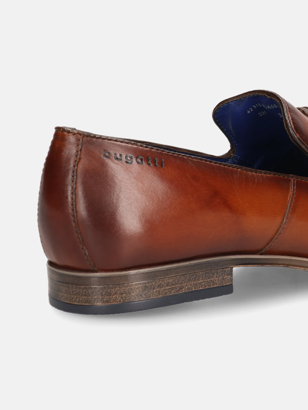 A cognac Men's bugatti Tassel Loafers featuring a round toe plain toe, moulded  heel. Made from premium genuine leather with a durable high quality synthetic outsole, this slip-on design offers both style and comfort.